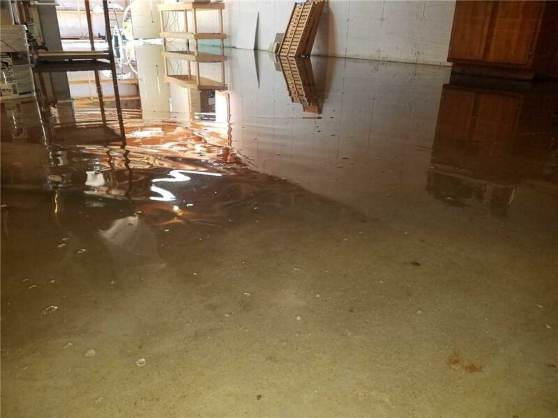 Picture related to residential basement water removal https://servicewaterrestorationpros.com/wp-content/uploads/2023/07/stopping-basement-flooding-basement-flooding-solutions-residential-basement-water-removal-commercial-basement-flood-restoration-basement-f2e71ae8.jpg